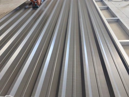 ASA-PVC roof sheets laid out on a roof structure