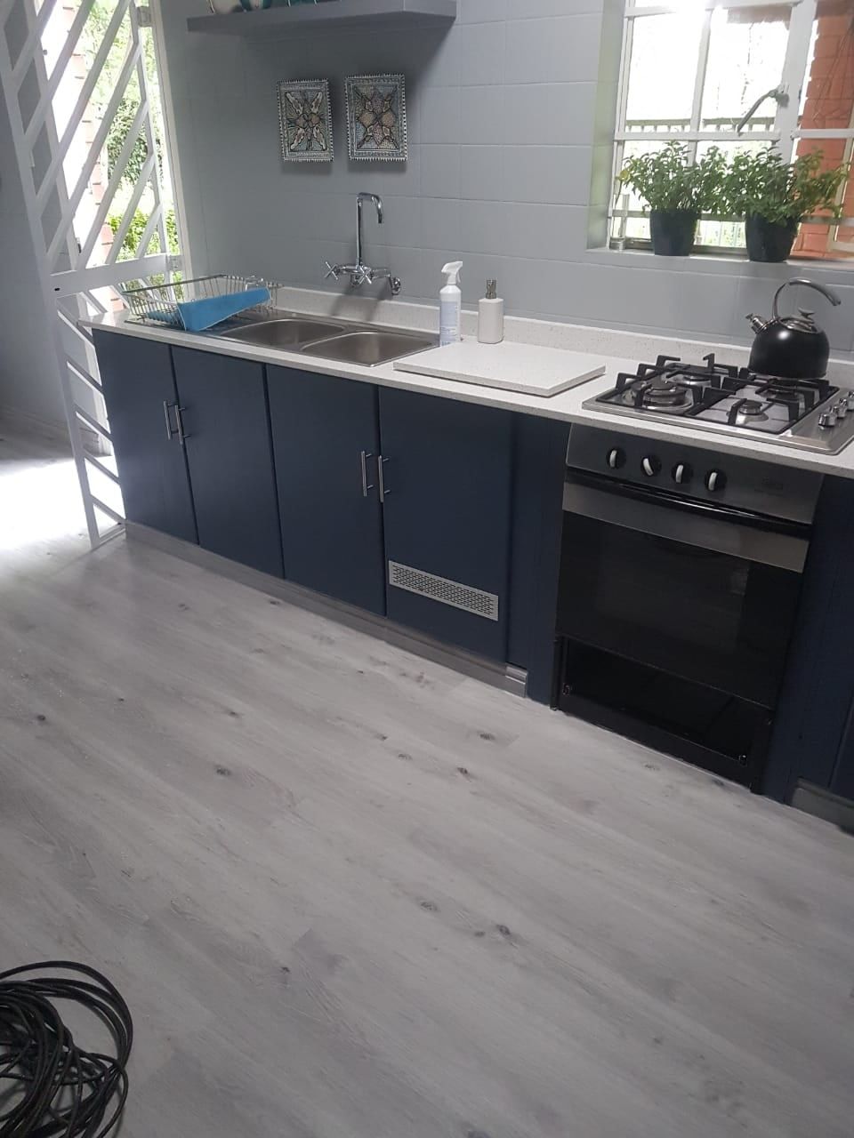 Light grey SPC flooring in a kitchen