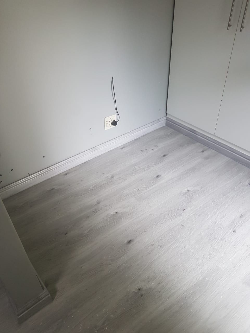 Light grey SPC flooring in a living area