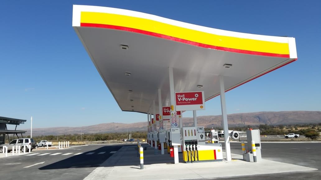 Service station canopy with a white PVC ceiling