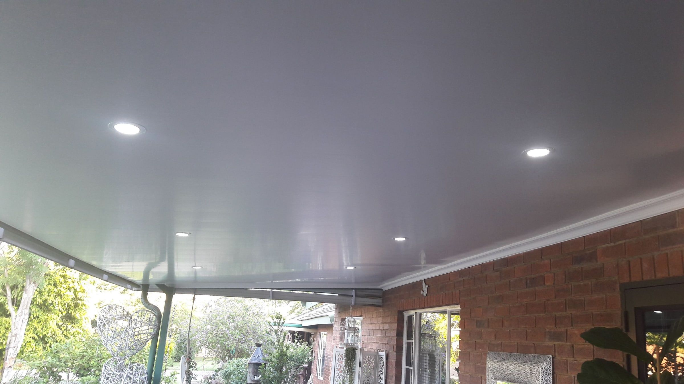 PVC ceiling with LED downlights on a covered patio