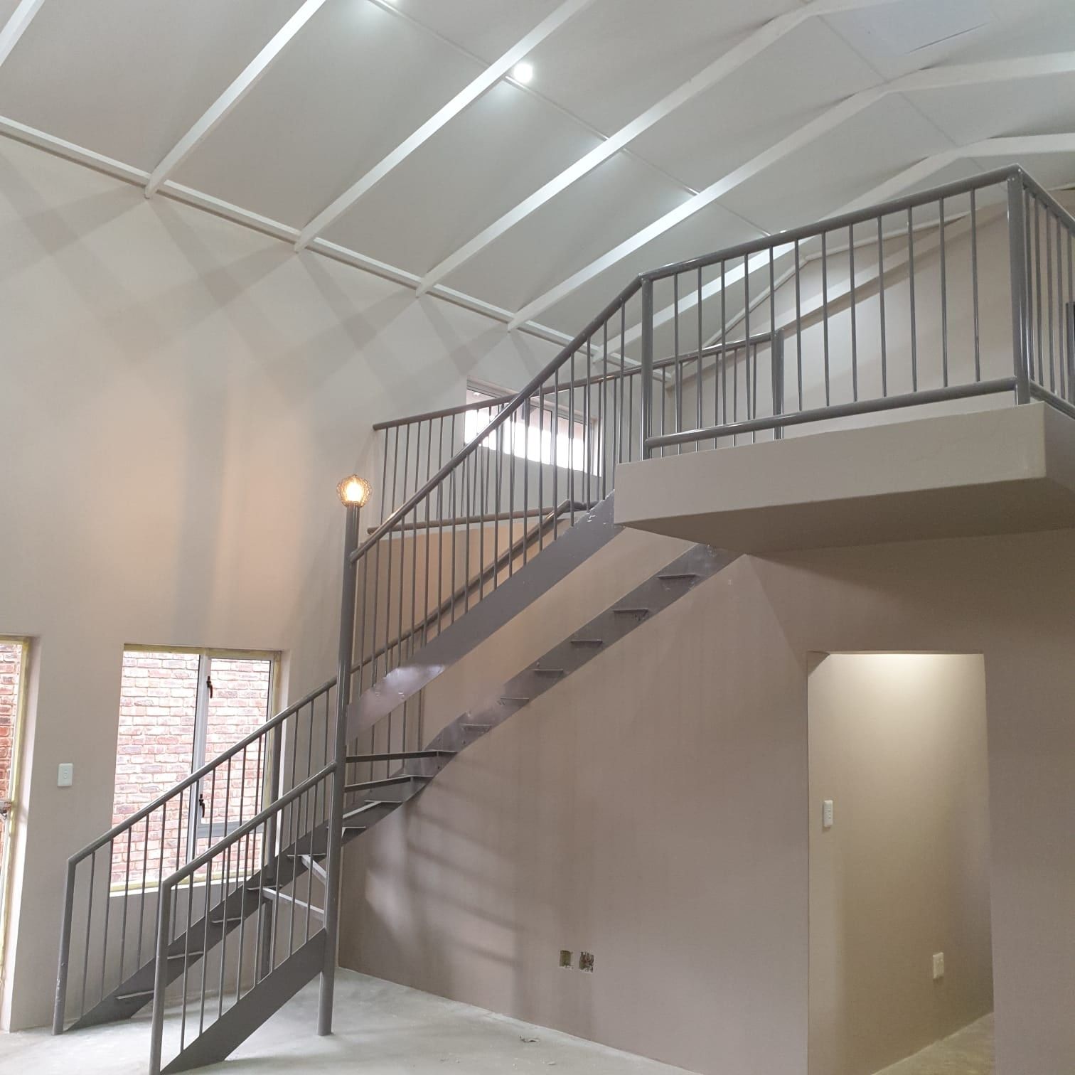 Double-volume room with staircase after an SPC flooring installation