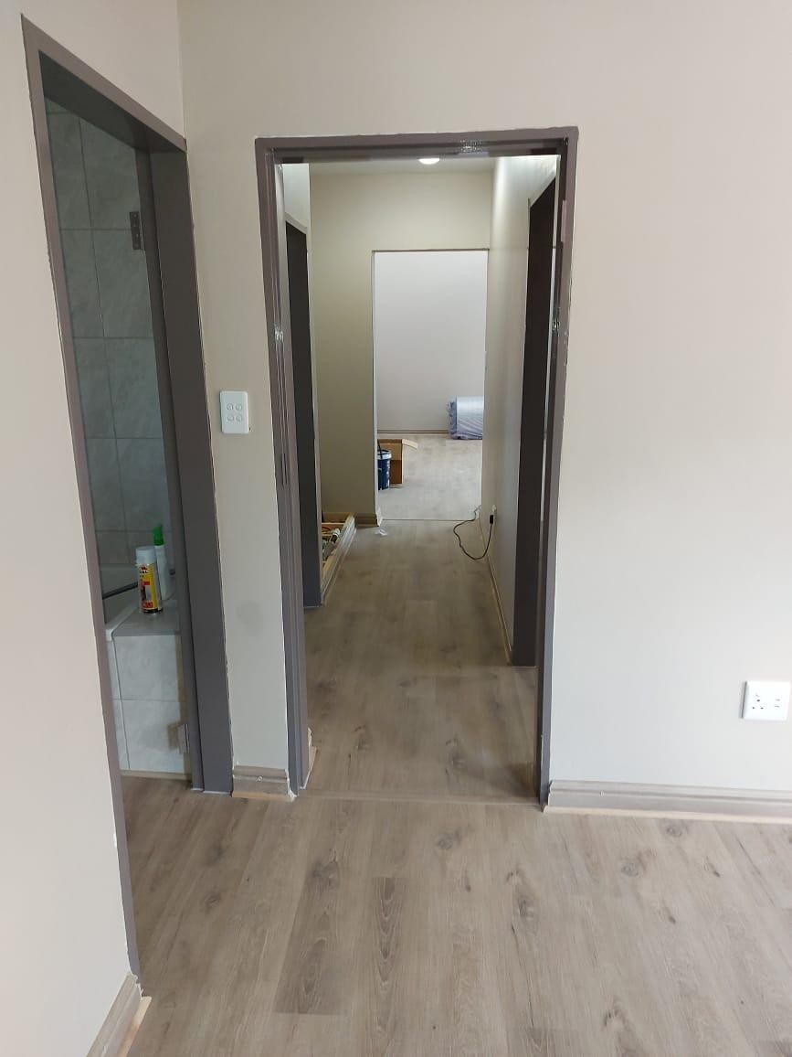 SPC flooring in a passage leading to a bathroom